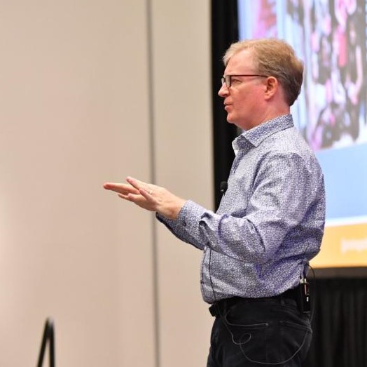 Tom Augenthaler speaking on stage at Content Marketing World